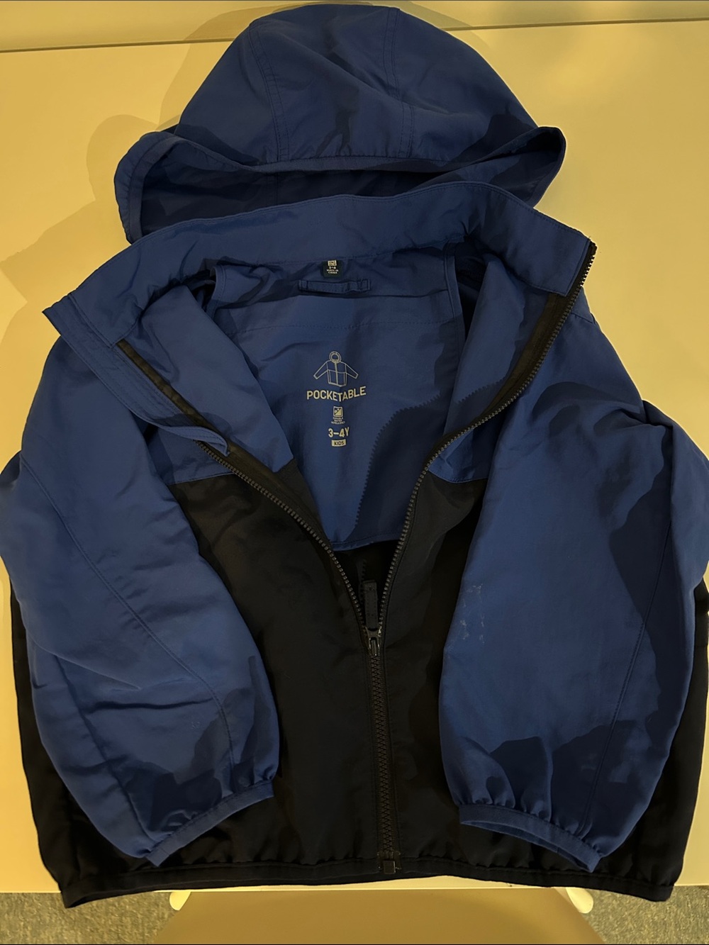 Uniqlo Kids Blue and Black Hooded Raincoat